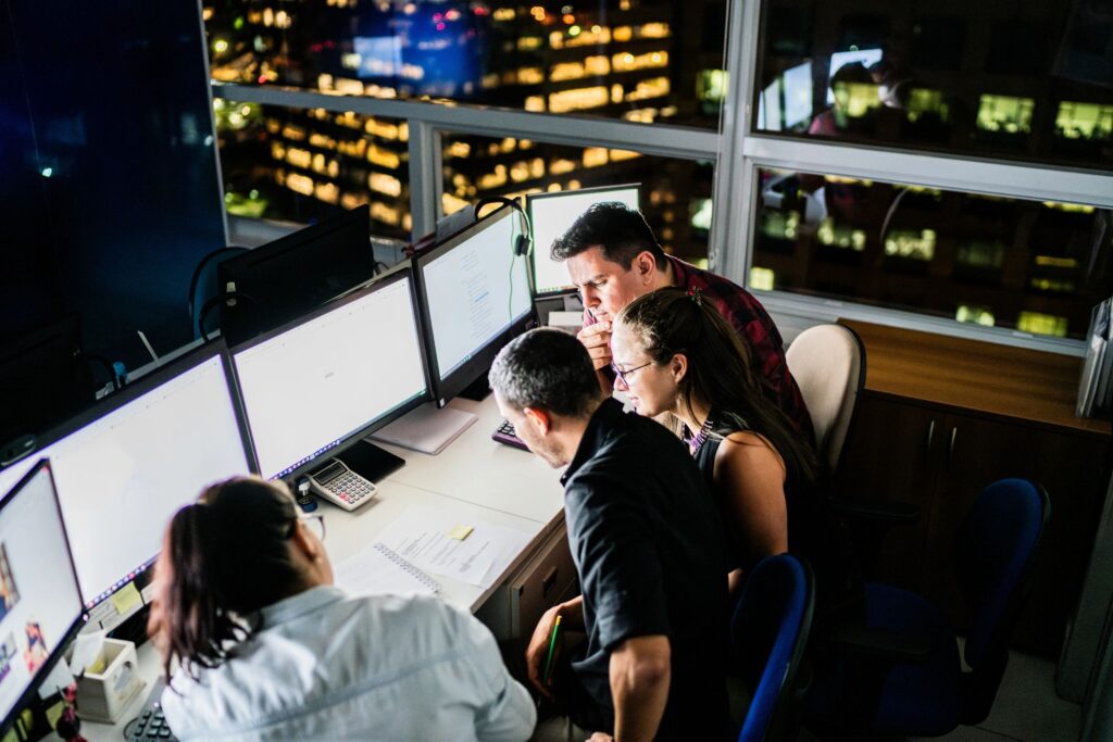 Dedicated team reunited working late at office
